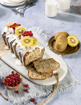 Yellow kiwi plum cake with banana, poppy seeds, currants and almonds