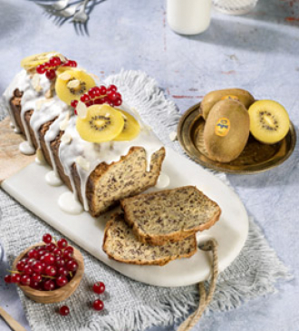 Yellow kiwi plum cake with banana, poppy seeds, currants and almonds
