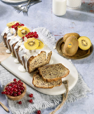 Yellow kiwi plum cake with banana, poppy seeds, currants and almonds