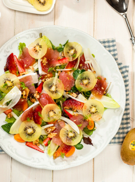 Summer salad with yellow kiwi and tuna