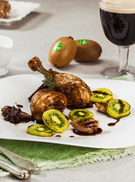 Guinness chicken thighs with braised shallots and grilled kiwi